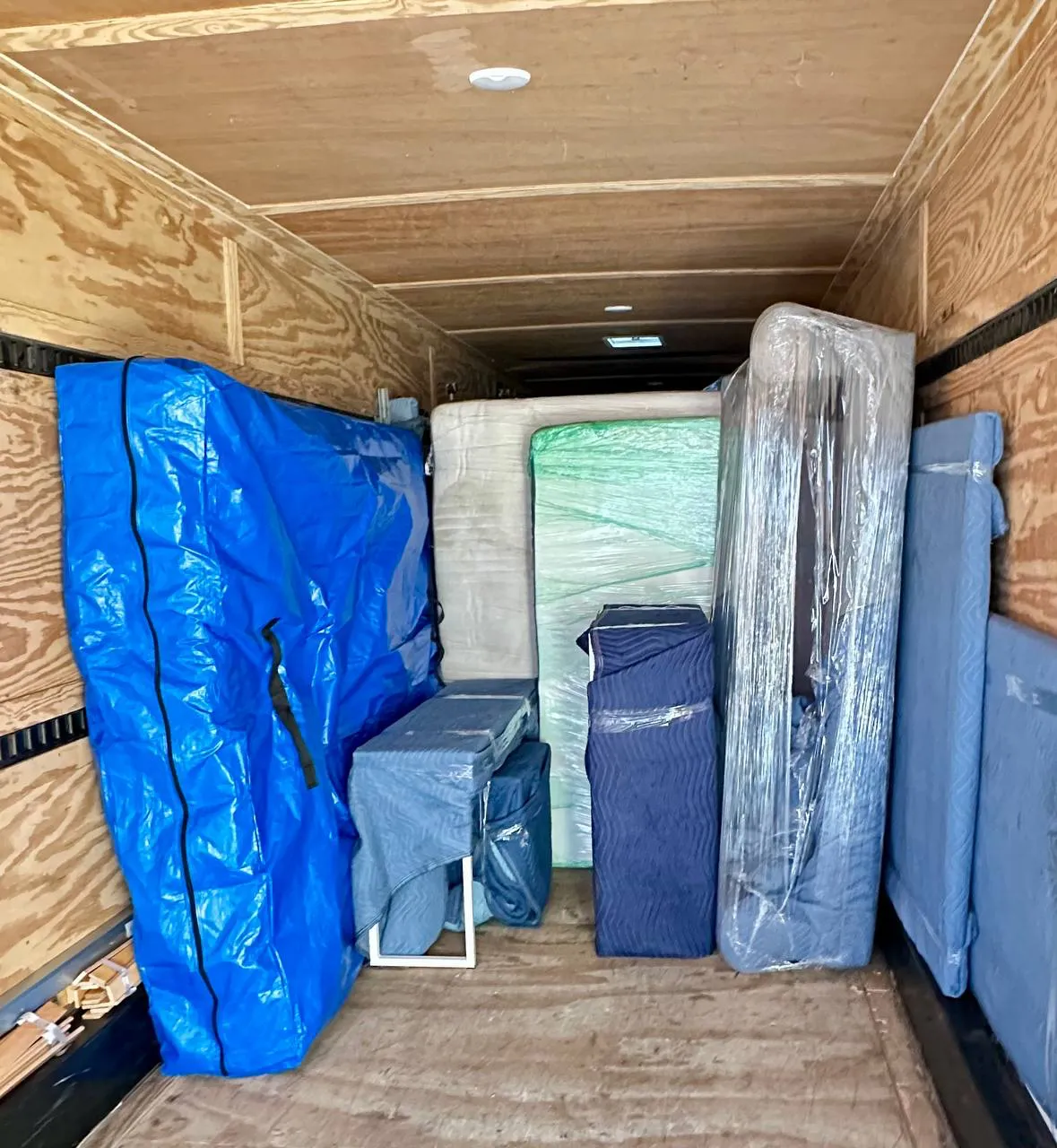 Mattress and bed secured inside a moving truck during a Toronto residential move